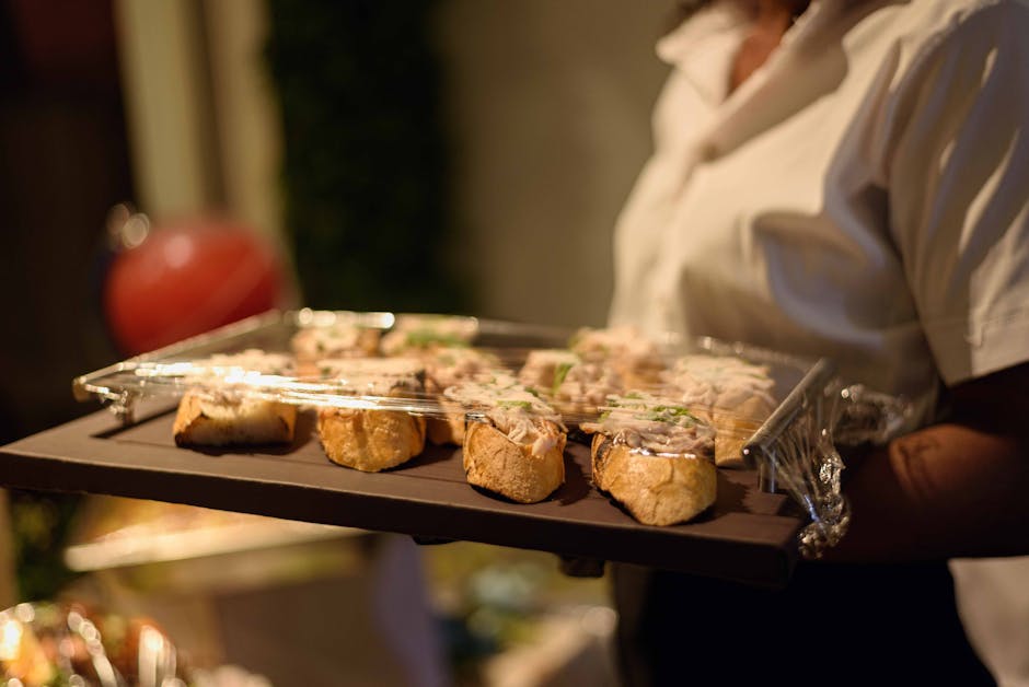 Waiter serving elegant appetizers at an event
