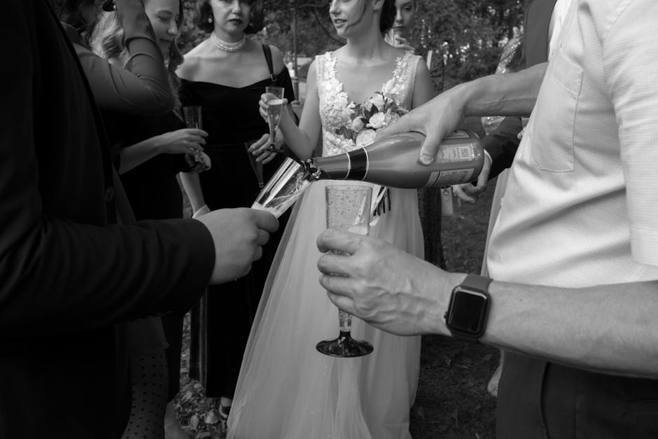 Pouring champagne glasses for a corporate toast